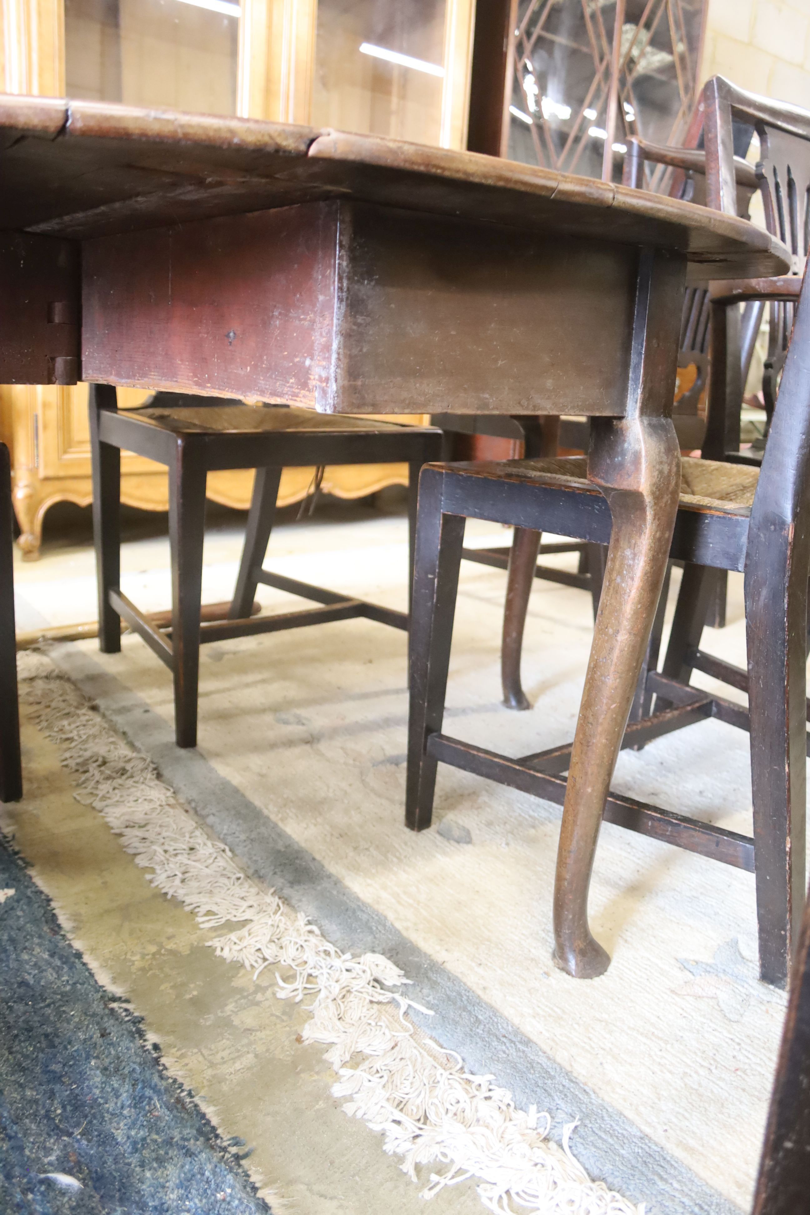 An 18th century mahogany oval drop-flap dining table, length 134cm extended, width 120cm, height 71cm